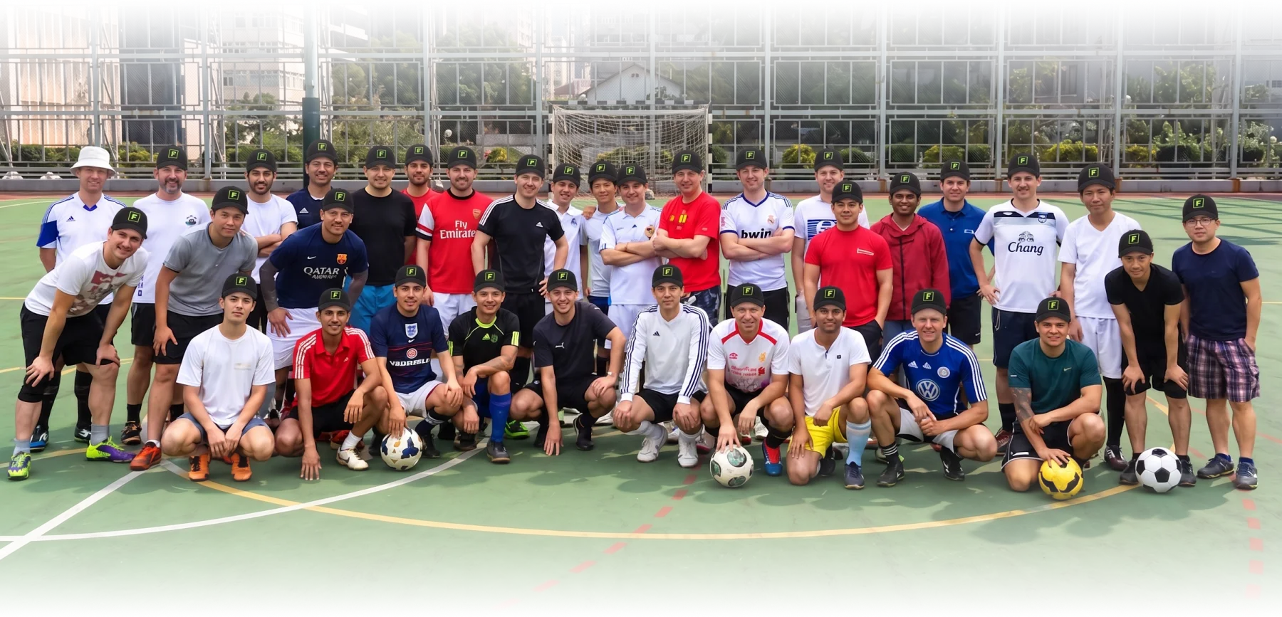 A group of football fans together on a football pitch